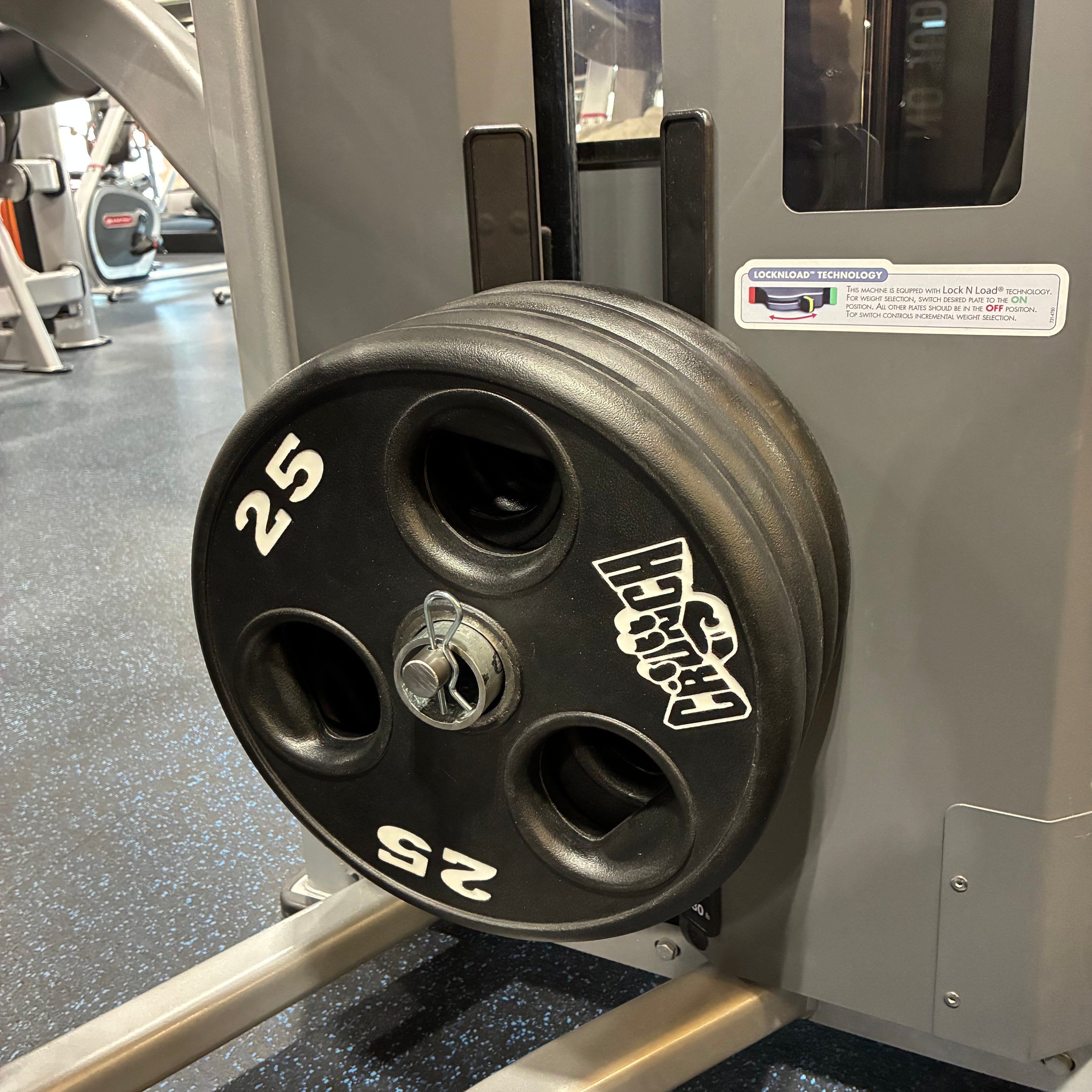 Extended-length gym pin used to add weight to switch-loaded and pin-loaded selectorized gym machines